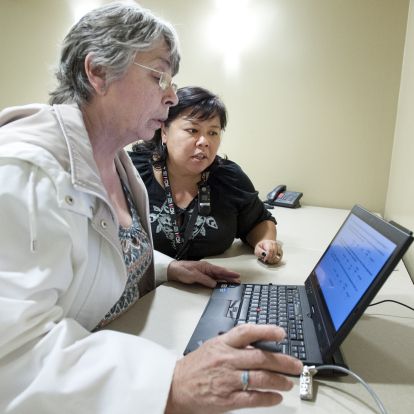 Nurse helping patient, follow up appointment, cancer care, evaluation